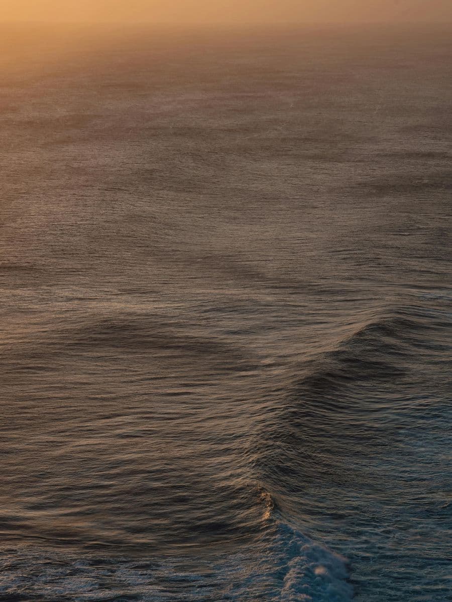 Bronze dusk light on the waves at Pererenan beach